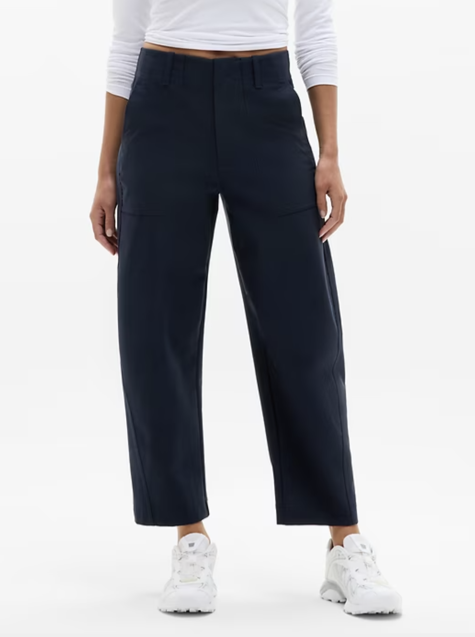 Navy blue high rise barrel pants from Athleta shown on model